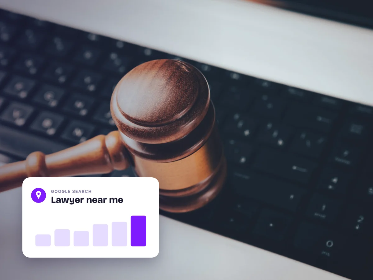 Judge gavel on a laptop keyboard with a lawyer near me search card, showing how clients find lawyers online