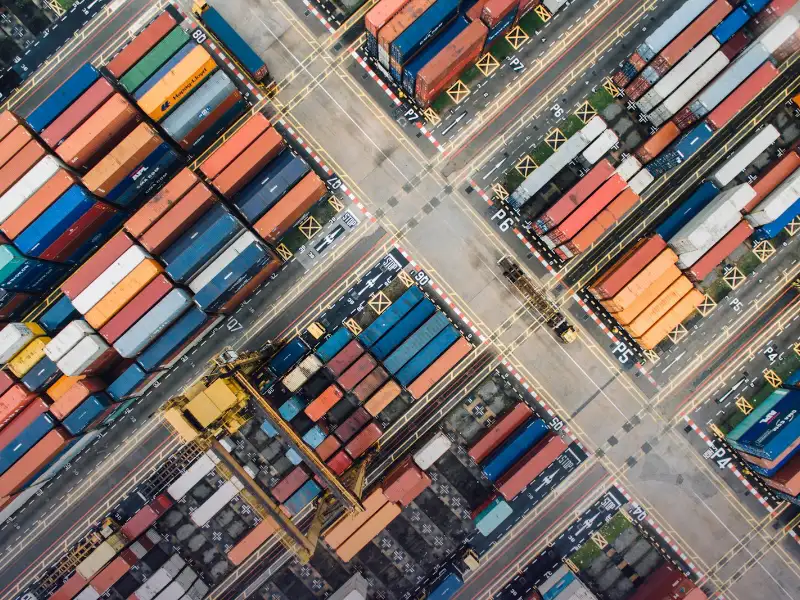 Aerial view of shipping containers at a port representing SEO for Karachi logistics and import-export companies