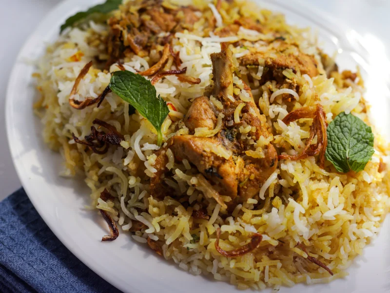 Plate of rice and meat representing SEO for restaurants in Rawalpindi