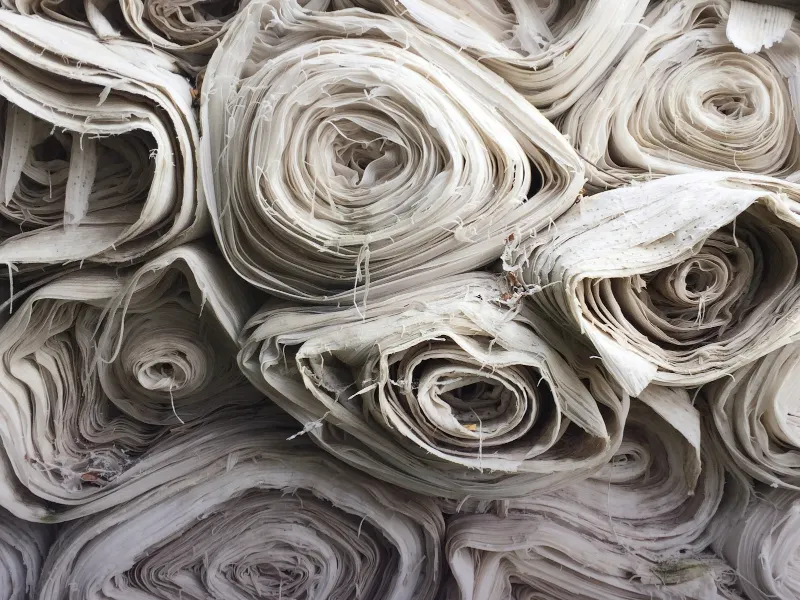 Rolls of fabric at a Faisalabad cloth market representing SEO for retailers and wholesalers